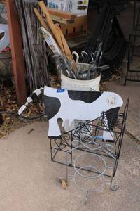 lot 569 image: Wooden garden cow, and plant stands