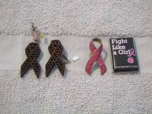 lot 29 image: breast cancer earrings, shirt pins