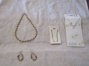 lot 48 image: kids rhinestone necklace and matching earrings , turquoise earrings, brown beaded necklace with 2 matching hoop earrings