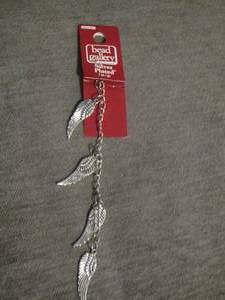 lot 121 image: Silverplate angel wings charm bracelet piece
