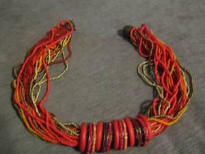lot 49 image: red, brown and orange beaded necklace