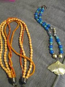 lot 62 image: orange beaded necklace, green and blue beaded necklace