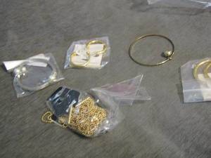 lot 87 image: gold necklaces, gold earrings, silver bracelet