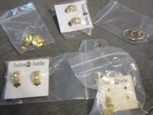 lot 105 image: gold earrings,