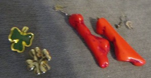 lot 30 image: 4 leaf clover and a 3 leaf clover shirt pins, red earrings