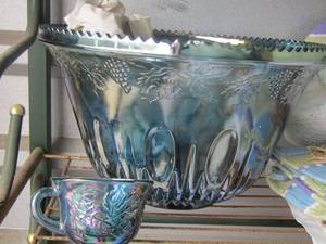 lot 5 image: Carnival Glass punch bowl with matching handled cups blue in color