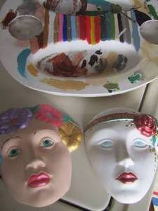 lot 14 image: 2 decorative ceramic lady masks and a paint tray