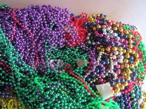 lot 108 image: MARDI GRAS  bead necklaces tote full