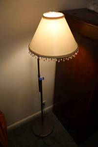 lot 12 image: 4 ft. floor lamp with dangles on shade