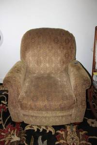lot 149 image: Upholstered arm chair with extending foot rest. Ashley furniture chair