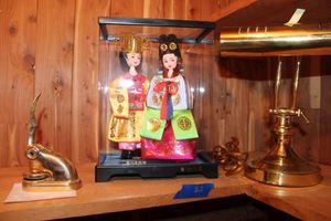 lot 82 image: Korean dolls in case, brass piano lamp and brass stamper embosser sealer