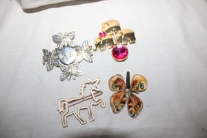 lot 182 image: Jewelry pins and hair clips one stamped Neman Marcus