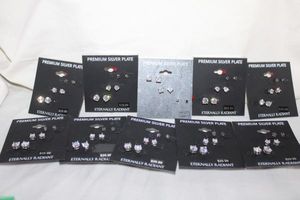 lot 208 image: Jewelry Silver plate earring sets marked mystik green and white CZ trios
