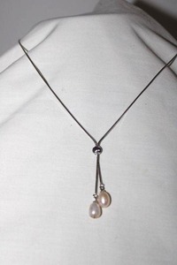 lot 222 image: Jewelry Sterling silver necklace with dual pearl pendants