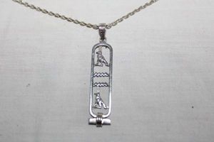 lot 231 image: Jewelry Sterling silver necklace with hieroglyph bar pendant