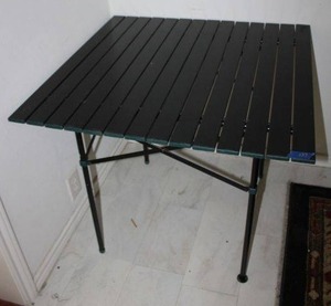 lot 127 image: Aluminum slat top camping table. Folds up as in photos.