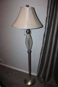 lot 27 image: Floor lamp with glass globe on column.