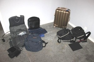 lot 29 image: Travel bags, rolling suitcase, portable seat massager