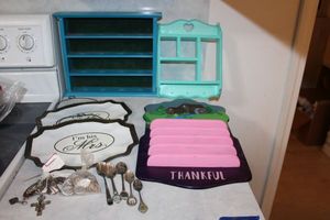 lot 41 image: Wooden display shelves, souvenir spoons, Mr. and Mrs. Metal plates, and saint pendants
