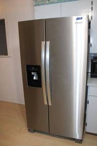lot 56 image: Whirlpool refrigerator model WRS325SDHZ08