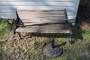 lot 262 image: Cast iron garden bench (needs new boards) and umbrella holder
