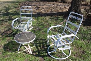 lot 269 image: White patio chairs and small table as shown