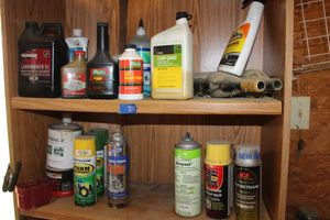 lot 335 image: Lawnmower oils, brake fluid, engine cleaner as shown