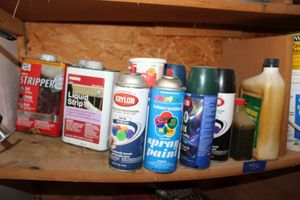 lot 330 image: Spray Paint cans, liquid stripper, tile adhesive