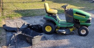 lot 273 image: John Deere riding lawn mower With bagging system was running when put away this winter