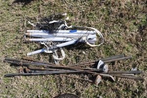 lot 403 image: Outdoor volleyball net and vintage golf clubs