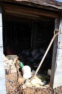 lot 406 image: Contents of storage building right side, Batteries, work out bench, metal shelvs, fan box, and more.