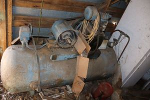 lot 377 image: 150-200gal 2-stage air compressor, motor needs repair. BRING EQUIPMENT AND LOTS OF HELPERS - VERY HEAVY AND HARD TO REMOVE