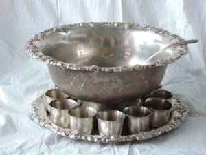 lot 1 image: punch bowl mid 20th Centuey large sheridan silver electro plate over brass punch bowl18w x 19h with ladle,round tray and 12 cups holds about 2 gallons
