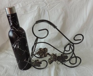 lot 75 image: wine bottle holder with decorative bottle