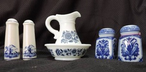 lot 149 image: Vintage Avon Milk Glass Bottle Blue Floral with a matching bowl - 2 sets of salt & pepper shakers both blue and white one set with windmills the other set like a leaf design