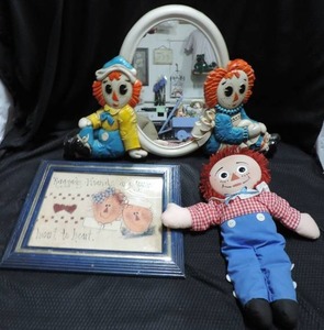 lot 170 image: Raggedy Ann Lot a wall pic. a mirror and a doll with a porcelain face