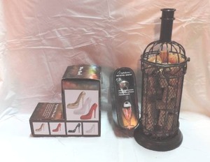 lot 196 image: High Heel Wine Bottle Holder  Aerating Poorer  and a Metal Wine Bottle Shaped Cork Holder
