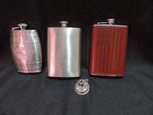 lot 215 image: 3 flask and flask funnel- jack Danials  plane  American flag