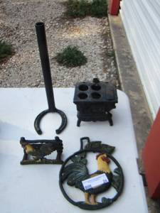 lot 24 image: metal rooster wall art- horse shoe paper towel holder- mini burning stove pieces missing