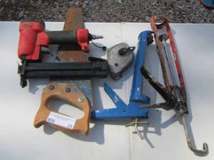 lot 35 image: misc. tool lot-  STAPLER,  SAW, CAULK GUNS