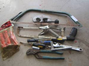 lot 63 image: hand saws- plyers- wrenches