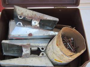 lot 83 image: Brown box with SAWHORSEBRACKETS  & NAILS