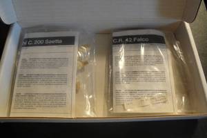 lot 11 image: 2 Collectible Plastic Model Plane Kits, 1- Falco Fiat CR42, I-Macchi C 200 Saetta, Sealed in Plastic with Storage Box. 2 XMoney