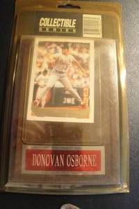 lot 12 image: Removable Topps Gold, Donovan Osborne, Cardinals Collectors Card in Plastic Sleeve Mounted on Wall Plaque, Sealed in Package