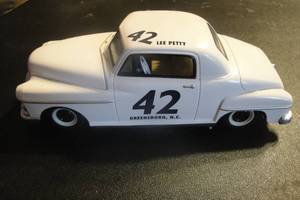 lot 41 image: Collectible Racing Champions 124 Scale Metal Die Cast Race Car, Lee Petty # 42,1949 Plymouth Deluxe, 50th Anniversary