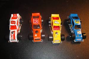 lot 65 image: 4- 1987 155 Scale Matchbox Modified Racers, 1-#4 Bugs, 1-# 6 Maynard Troyer,  1-# 12 Car, 1- Ron Bouchard, 4 X Money
