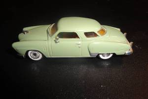 lot 84 image: 2- Die Cast Cars, 1-Studebaker  #182 By Racing Champions, 1- Mini Cooper  2 X Money