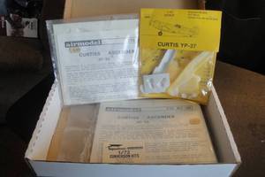 lot 122 image: 1- 172 Scale Beechnut Models Curtis YP-37 Plastic Plane Kit, 2-172 Scale Air Model Curtis Ascender XP55 Conversion Kits, 3 X Money