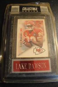 lot 123 image: Removable Kansas City Chiefs, Lake Dawson Collector Card in Plastic Sleeve Mounted on Wall Plaque, Sealed in Package.