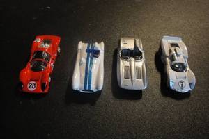 lot 142 image: 4- Die Cast Hot Wheels Race Cars, 4 X Money